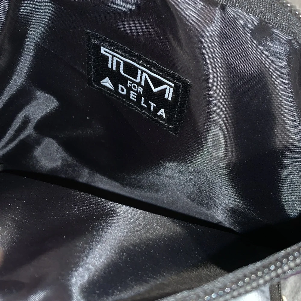 Tumi Purple and Gray Travel Pouches with Socks and sleep masks